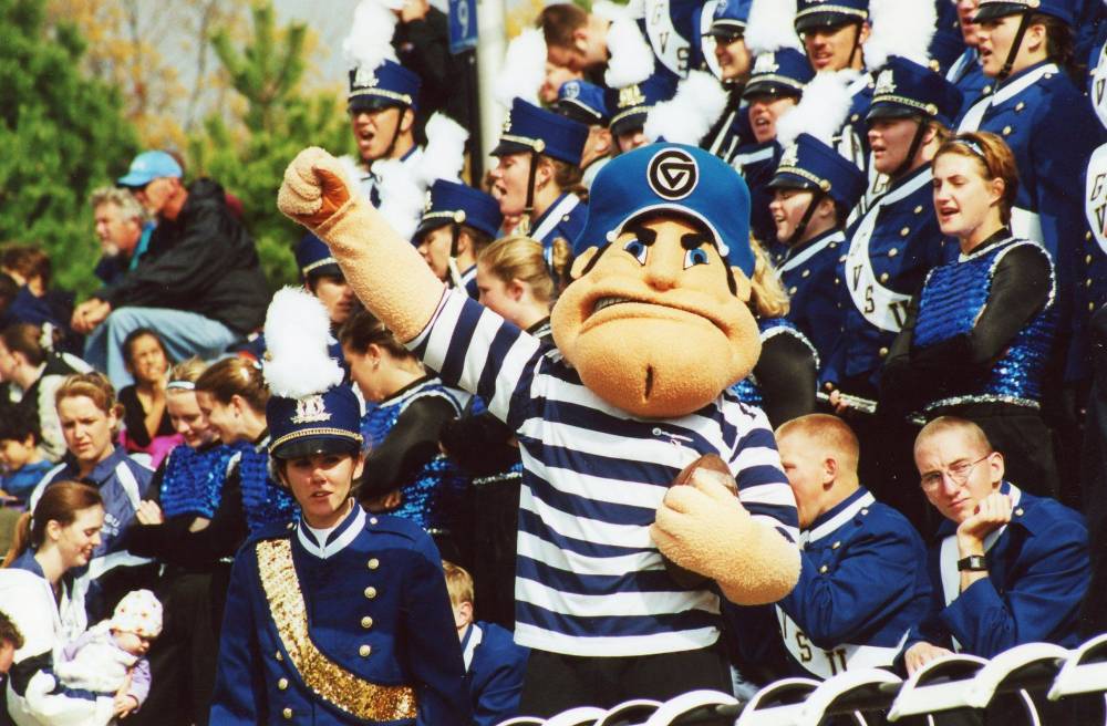 Image 1 of 14 Louie cheers on the Lakers at Lubbers Stadium surrounded by the Laker Marching Band